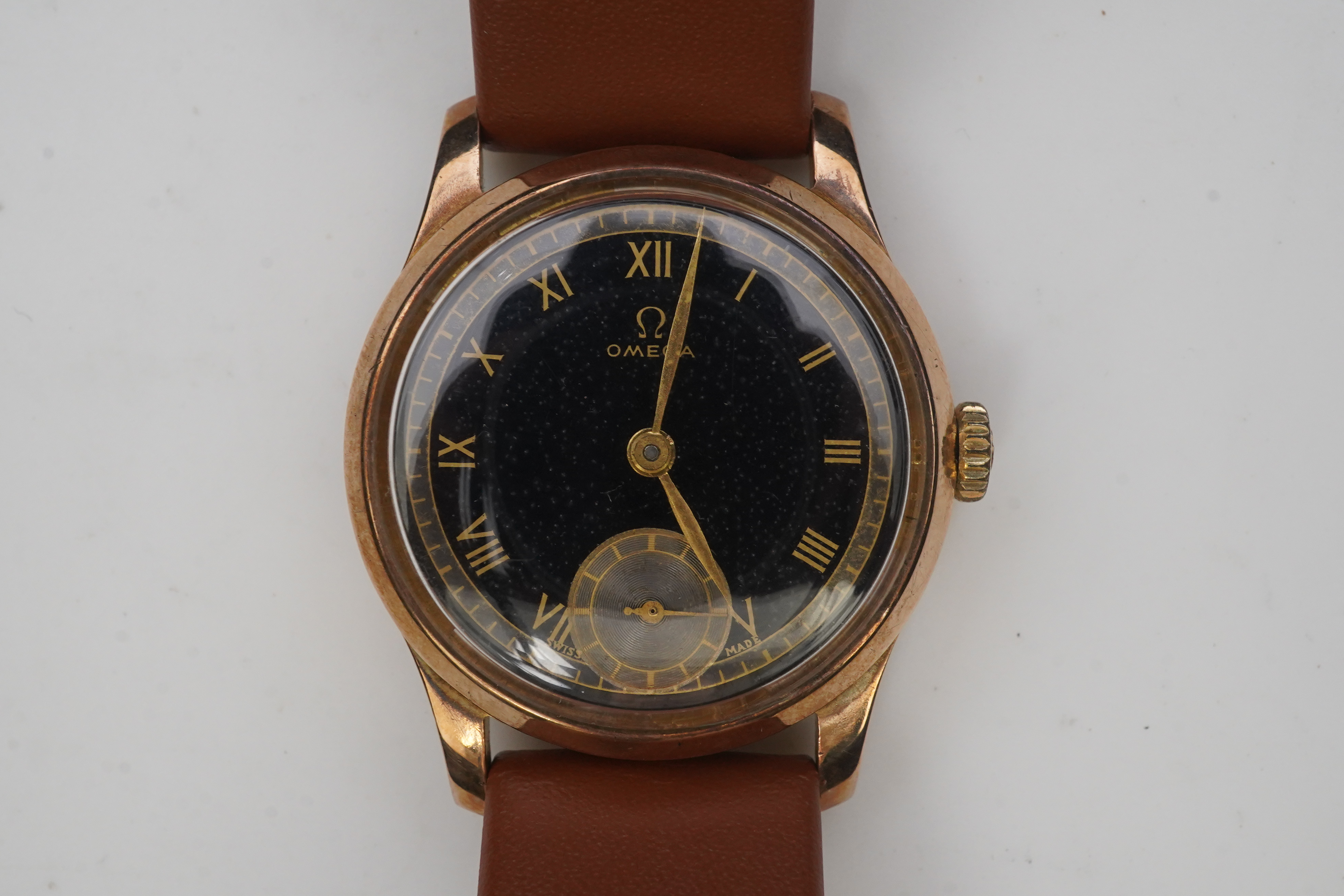 A gentleman's 1940's 9ct gold Omega manual wind wrist watch, on a later associated leather strap